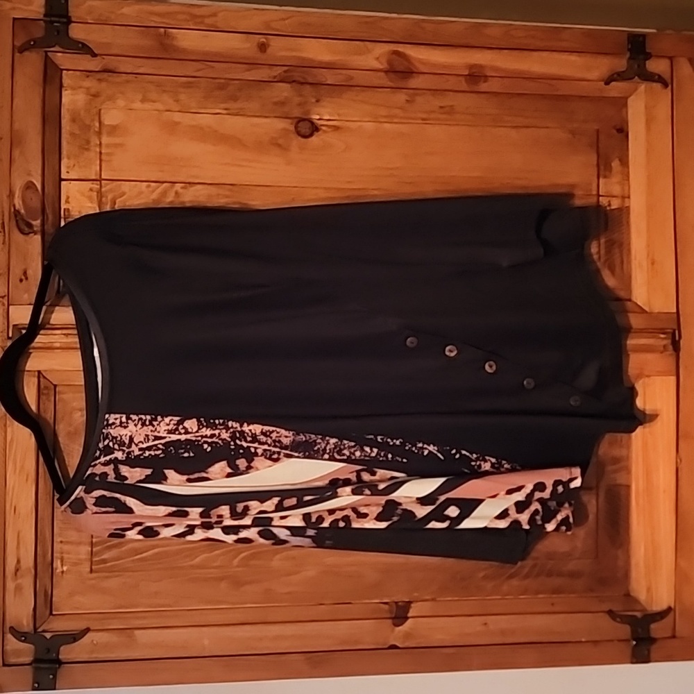 Women's pull over dress shirt with animal print and buttons for show.